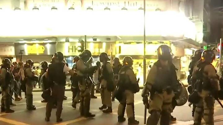 Hong Kong protesters take to the streets for the 15th weekend in a row