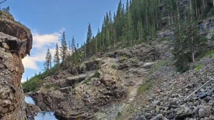 Motorcyclist falls off Colorado cliff, survives