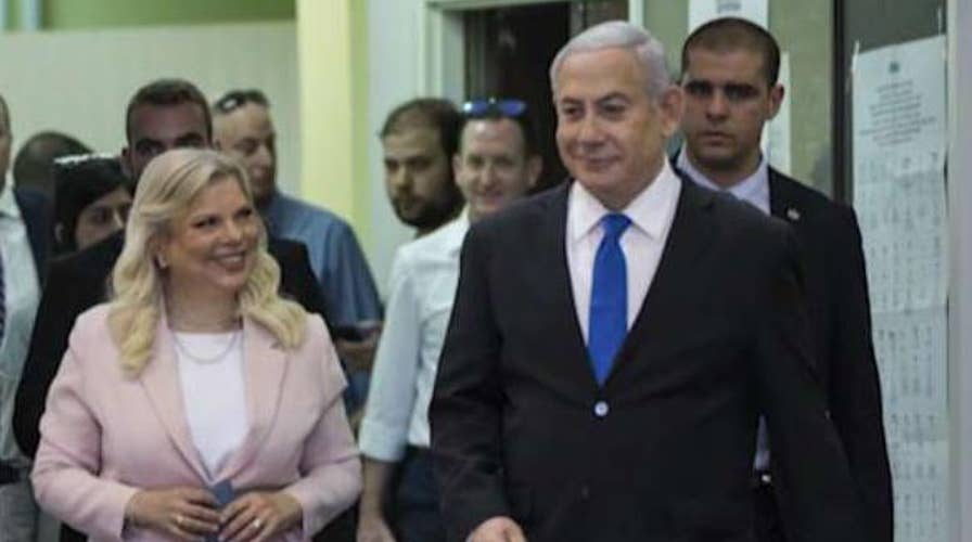 Benjamin Netanyahu faces unknown political fate as Israeli exit polls show tight race