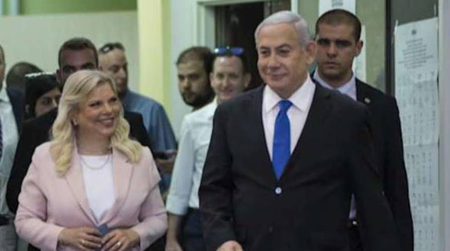 Benjamin Netanyahu faces unknown political fate as Israeli exit polls show tight race