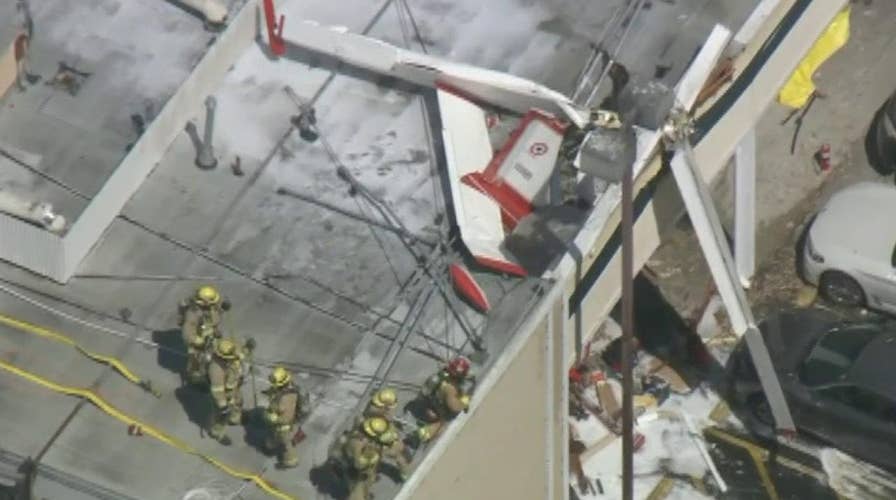 One dead, one injured after small plane crashes onto strip mall roof in California