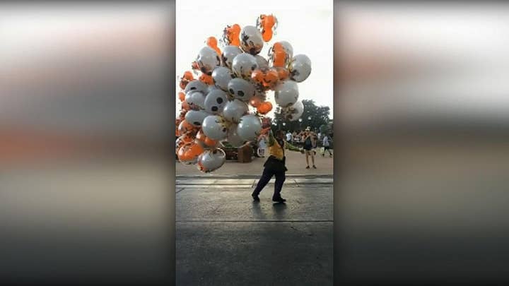 Walt Disney World employee nearly blown away by strong wind