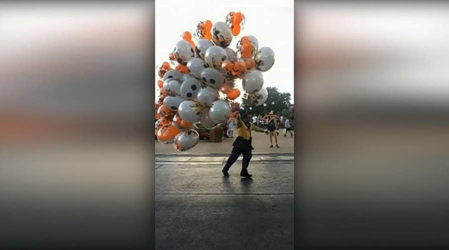 Walt Disney World employee nearly blown away by strong wind