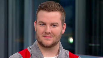 Busch Light sends sign-holding football fan a year's supply with his face on the can