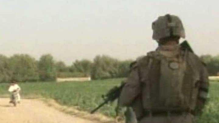 13 Marines charged in human smuggling case