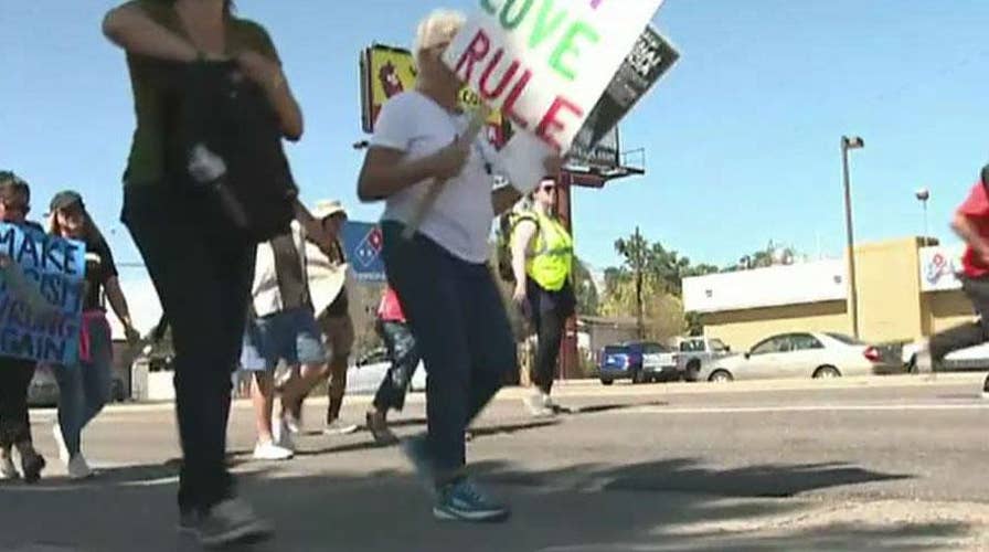 Pro-ICE and anti-ICE protestors face off in Denver, Colorado