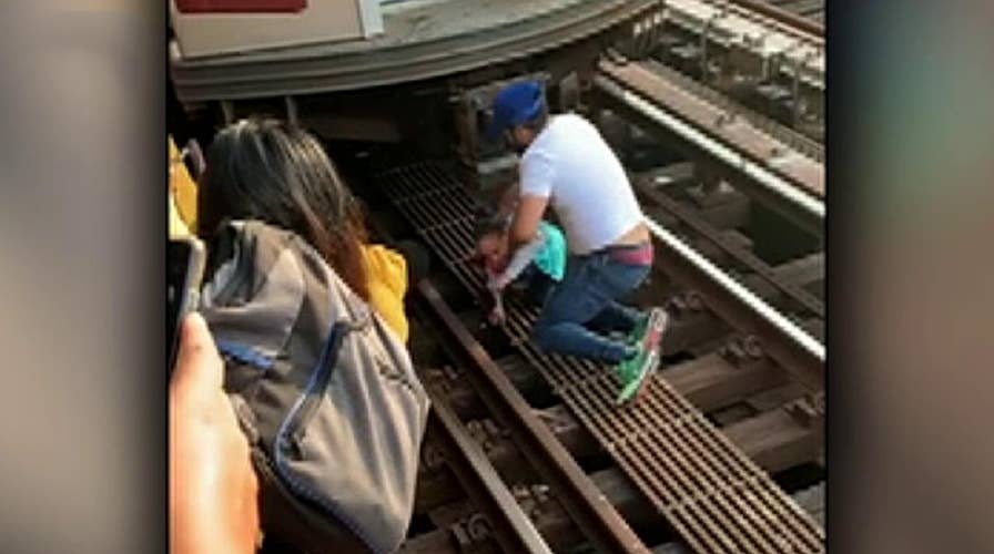 Raw video: Five-year-old girl rescued from the tracks at a Bronx subway station