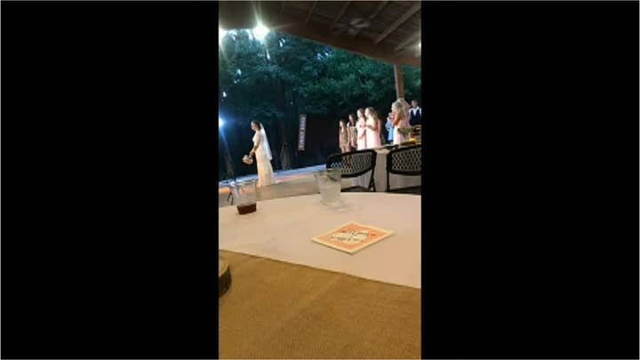 Watch: Wedding guest flees reception after girlfriend catches bride's bouquet