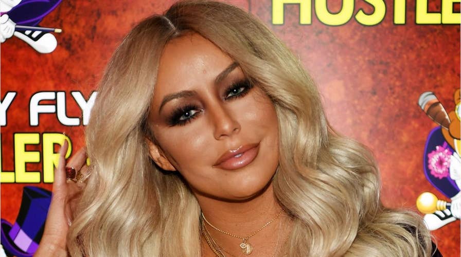 Aubrey O'Day says an American Airlines flight attendant made her take her shirt off 'in front of the entire plane'