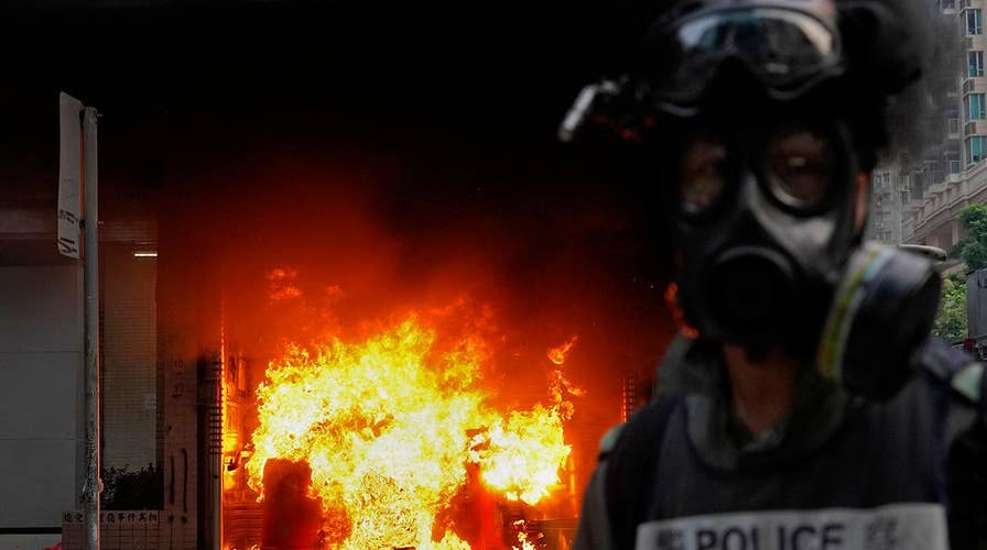 Tens of thousands of demonstrators face off in Hong Kong against police