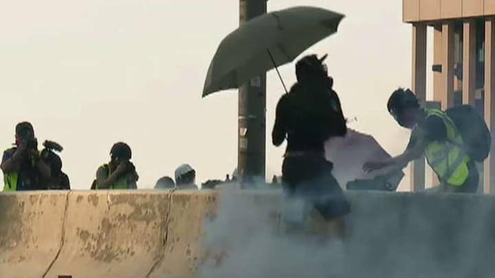 Hong Kong clashes escalate as police officer shoots protester during demonstration