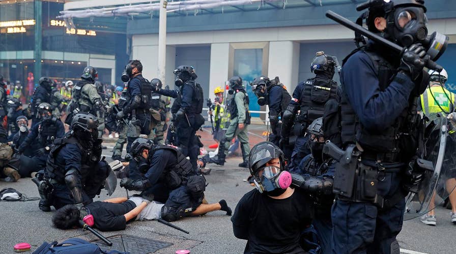 Hong Kong police say a pro-democracy protester was shot in the chest by an officer