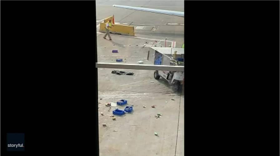 Watch: Chicago airport catering cart nearly slams into plane on tarmac