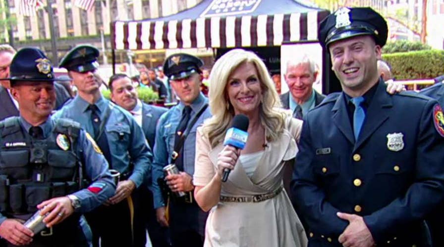 Law enforcement officers have a cup of coffee on the Fox Square!