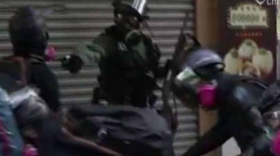 Hong Kong protestor shot in chest amid China's anniversary parade