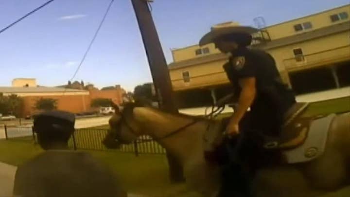 Police release bodycam video of mounted police officer tying suspect with rope, making him walk behind horse
