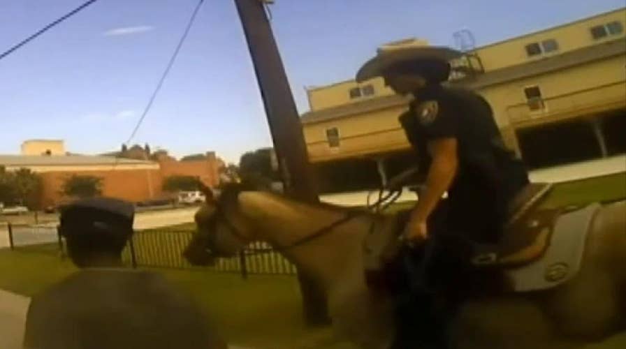 Police release bodycam video of mounted police officer tying suspect with rope, making him walking behind a horse