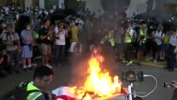 Hong Kong protesters take to the streets in fiery response to face mask ban