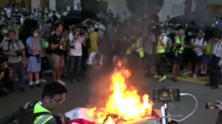 Hong Kong protesters take to the streets in fiery response to face mask ban