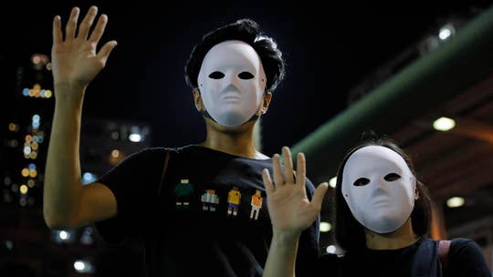 Chief executive of Hong Kong shuts down public transportation, bans face masks