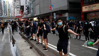 Hong Kong rallies turn violent after thousands defy face mask ban