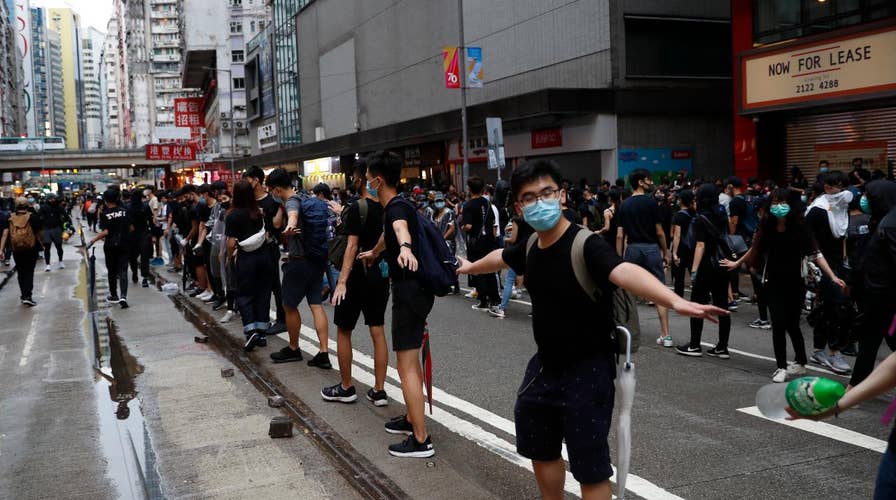 Hong Kong rallies turn violent after thousands defy face mask ban