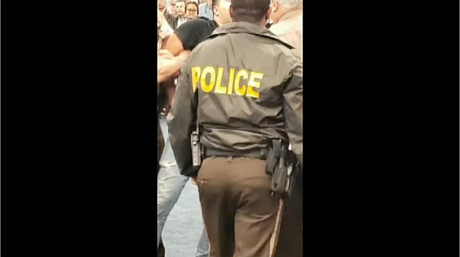 Man detained after trying to rush American Airlines flight