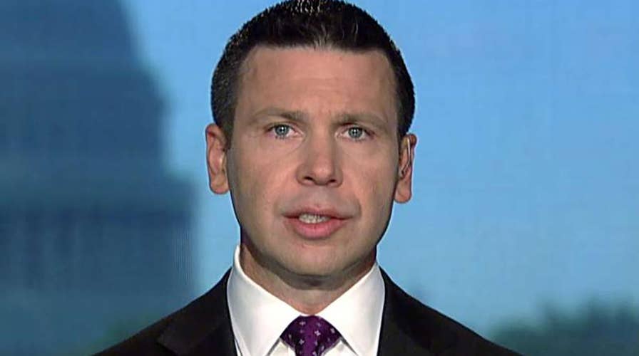 McAleenan reacts to being shouted off stage at Georgetown Law School