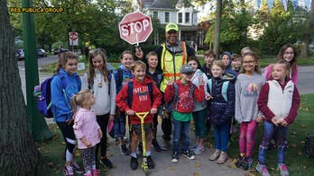 Community surprises crossing guard, known for putting smiles on kids' faces, for 80th birthday: 'I am blessed'