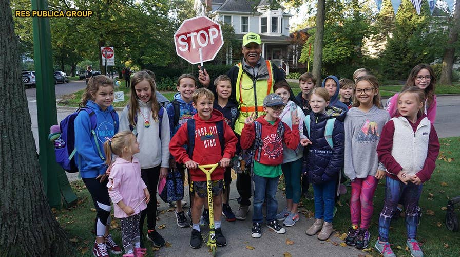 Community surprises beloved crossing guard for 80th birthday
