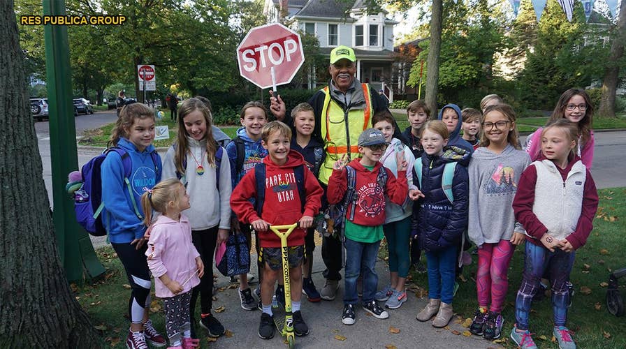 Community surprises beloved crossing guard for 80th birthday