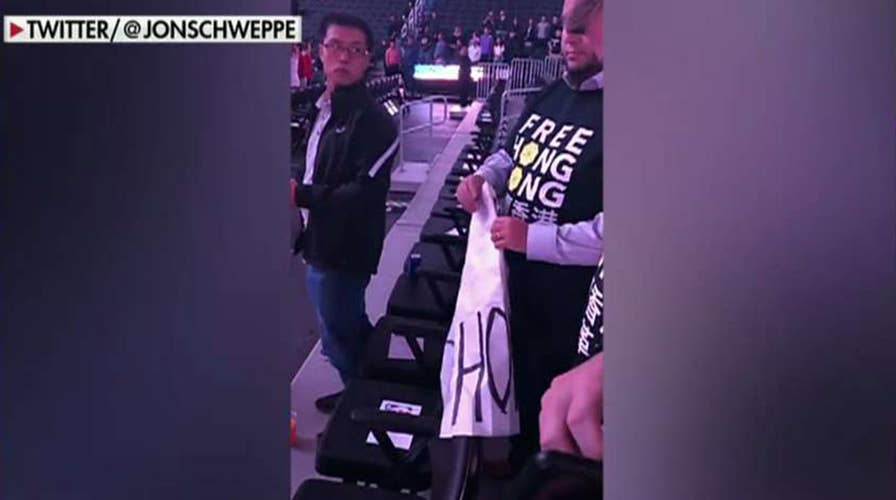 Pro-Hong Kong signs confiscated at NBA game