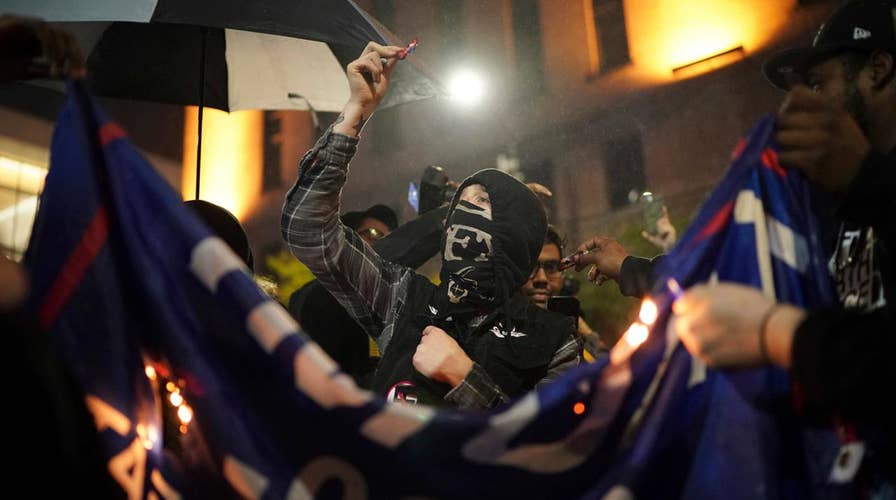 Democratic protesters harass police, burn MAGA hats outside of Trump rally in Minnesota