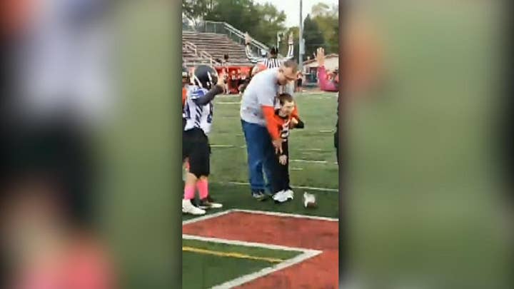 7-year-old boy with cerebral palsy becomes honorary football captain for a day