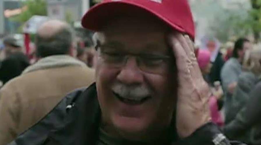 Trump supporter gets spit on during a live TV interview outside the president's Minnesota rally