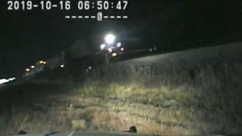 Video shows Utah trooper risk his life to save driver stuck on train tracks