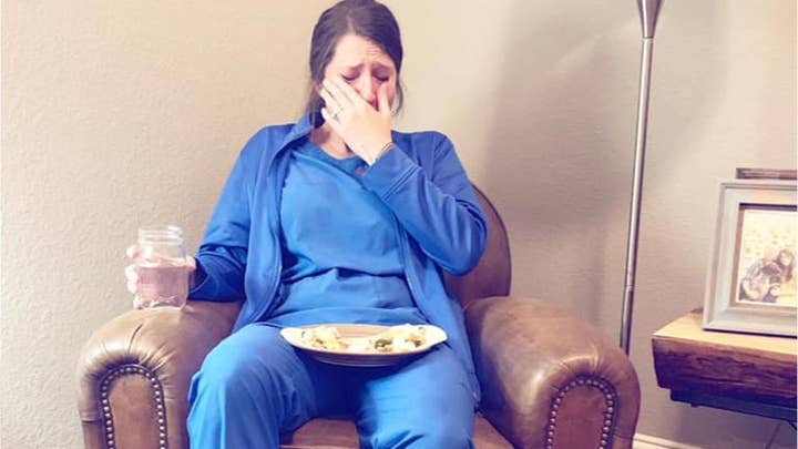 Photo of emotional nurse after 'particularly hard day' goes viral