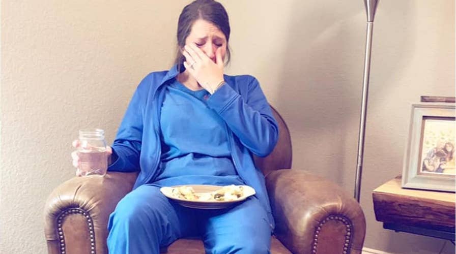Photo of emotional nurse after 'particularly hard day' goes viral