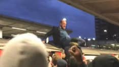 London rush-hour commuters yank climate-change protesters from roofs of trains