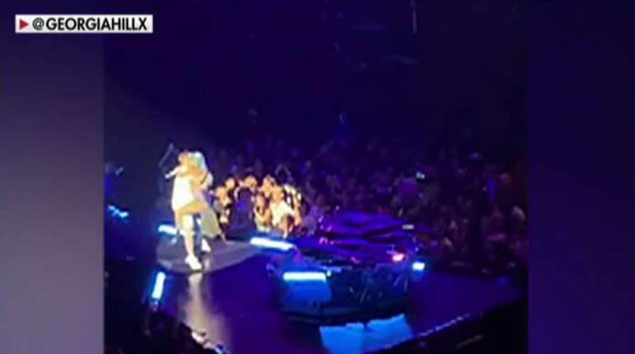 Lady Gaga falls off stage during concert