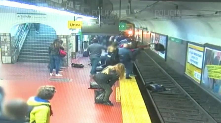 Commuters help save woman who fell onto Buenos Aires subway tracks