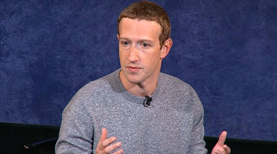 Facebook CEO Mark Zuckerberg has a fireside chat with NewsCorp CEO Robert Thomson
