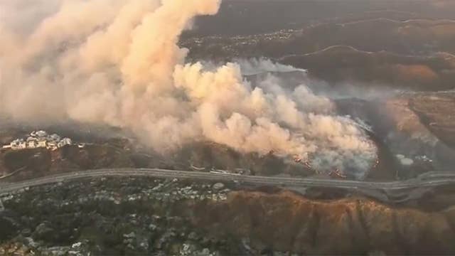 Wind-driven Wildfire Near Getty Center Threatens Homes, Forces ...