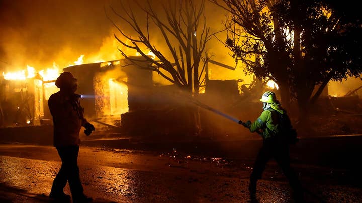Wind-driven wildfires in Northern and Southern California destroy homes, force evacuations