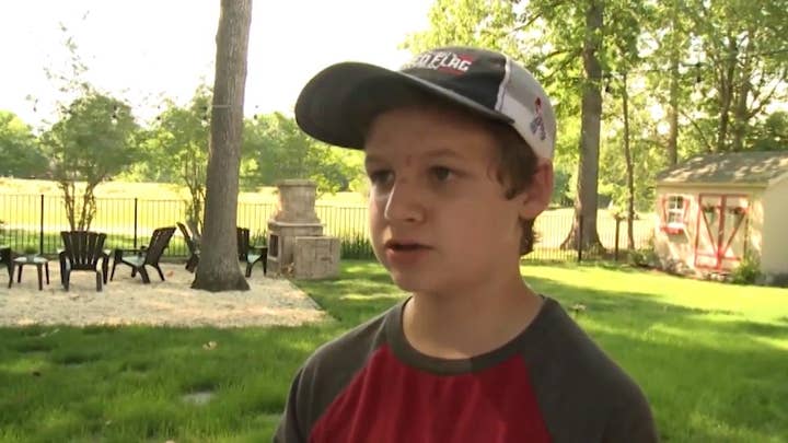 14-year-old son of service member covers neighborhood in American flags