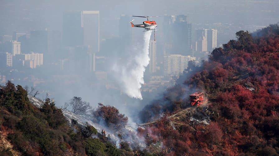 Fire crews race to tamp down Getty Fire hotspots before Santa Ana winds return to Los Angeles