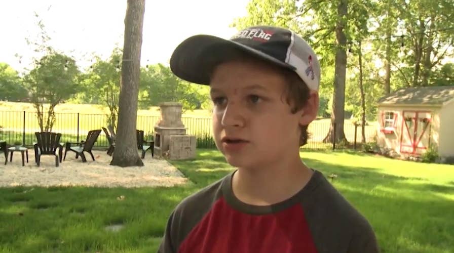 14 year old son of service member covers neighborhood in American flags