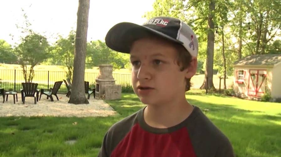 14 year old son of service member covers neighborhood in American flags
