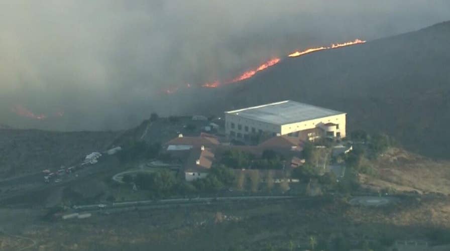 Wind-driven brushfire threatens Ronald Reagan Presidential Library in Southern California