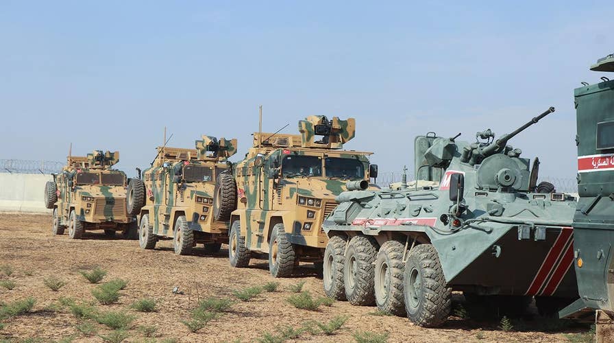 Russian and Turkish forces begin joint patrols in northern Syria